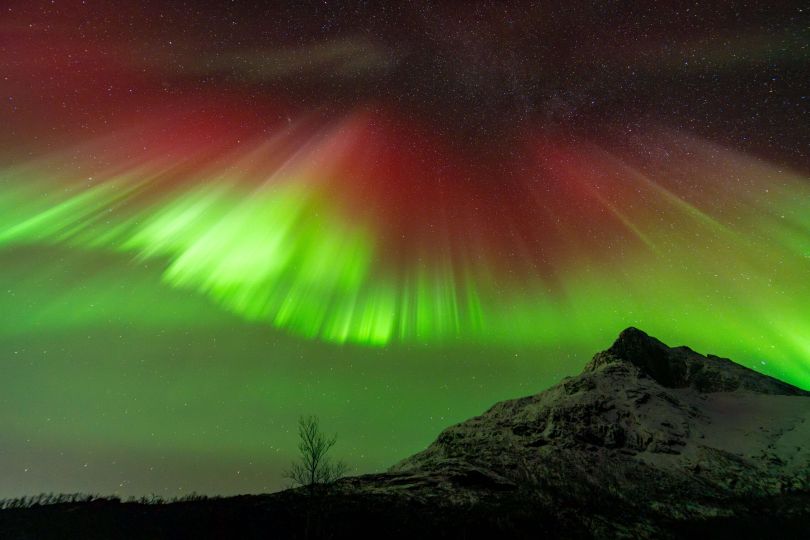 Northern lights in diffrent colors over mountain