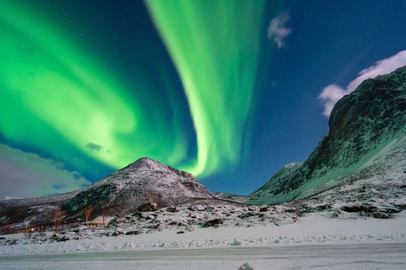 Northern lights over mountain