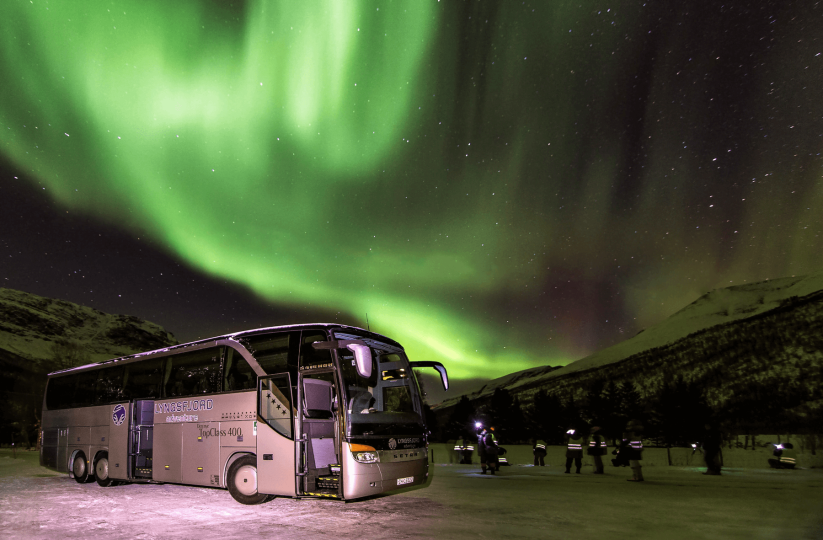 Northern lights over bus