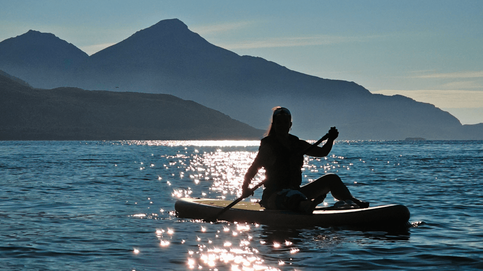 woman enjoying sun on SUP board