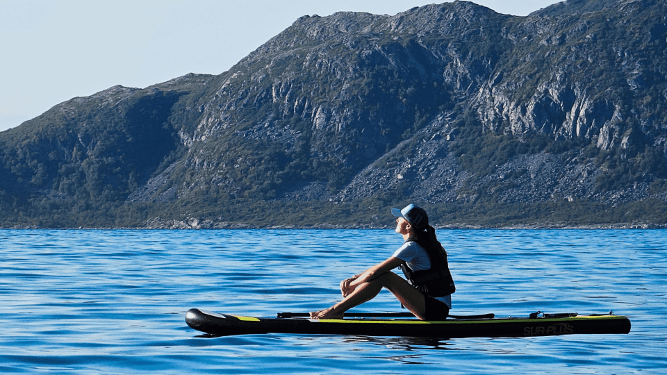 woman enjoying sun on SUP board