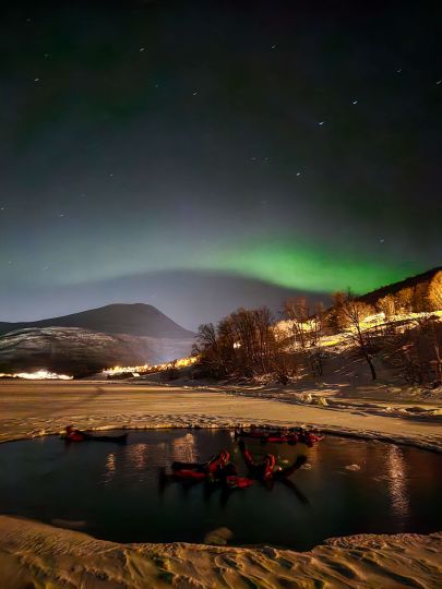 Floating under the northern lights