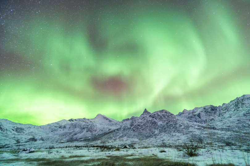 Northern lights over mountain