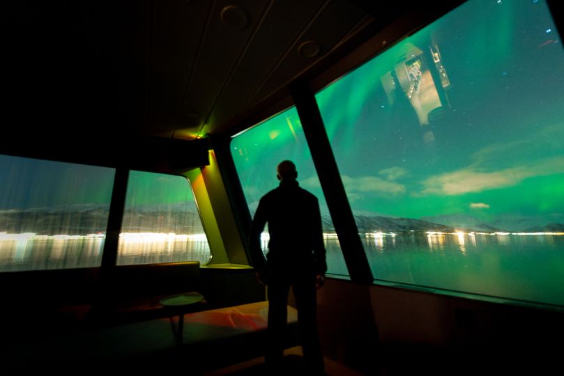 Northern lights over Rødne fjord Cruise boat, photo by David Gonzalez