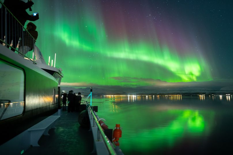 Northern lights over Rødne fjord Cruise boat, photo by David Gonzalez
