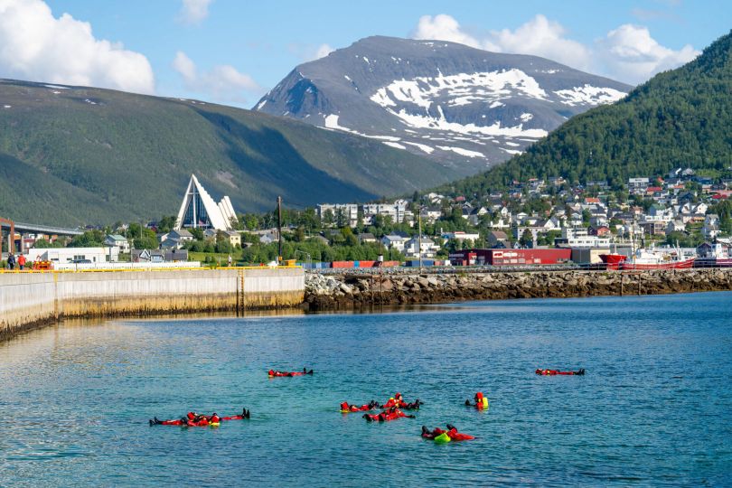 Group of floaters at Vervet with the Arctic Cathedral and Tromsdalstinden in the background Edelweiss_Loren Bedeli