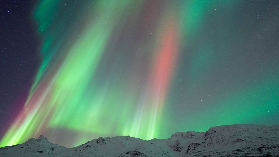 Northern lights in diffrent colors over mountain