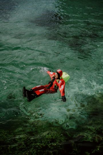 person floating in the harbour at Vervet