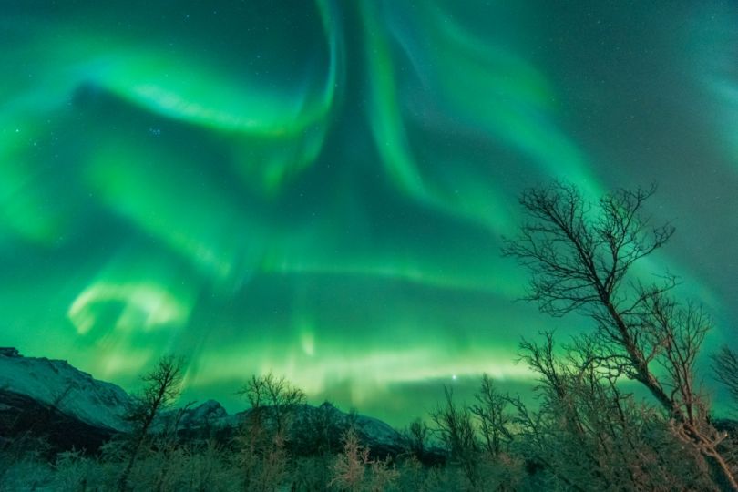 Northern lights over mountains