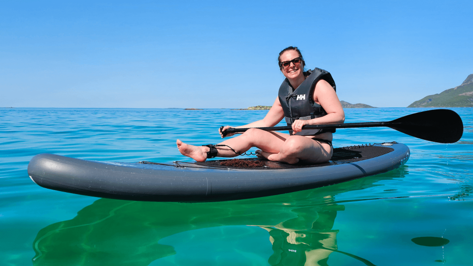 woman enjoying sun on SUP board