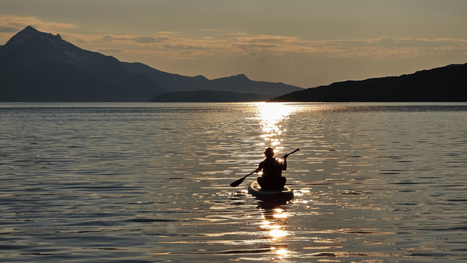 woman enjoying sun on SUP board