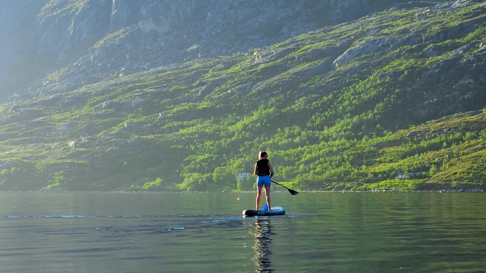 woman enjoying sun on SUP board